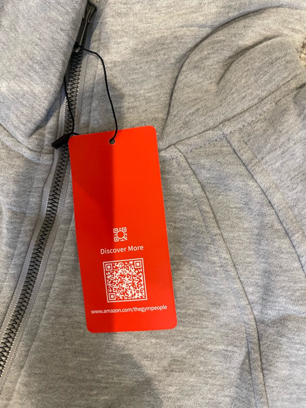 Grey Zip-Up Hoodie with Red Tag